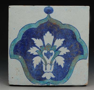 Lot 42 - AN ISLAMIC GLAZED POTTERY TILE