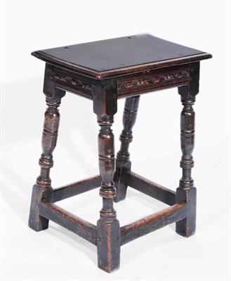 Lot 47 - A 17TH CENTURY OAK RECTANGULAR JOINT STOOL on ring turned legs with stretcher supports