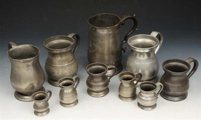 Lot 54 - A VICTORIAN PEWTER QUART TANKARD with scroll handle