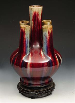 Lot 73 - A CHINESE SANG DE BOEUF TULIP VASE with five stems and baluster body