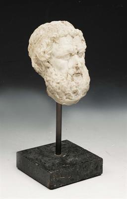 Lot 80 - A GRAND TOUR STYLE CARVED MARBLE HEAD IN THE ROMAN STYLE of Hirsute male subject after the Antique o