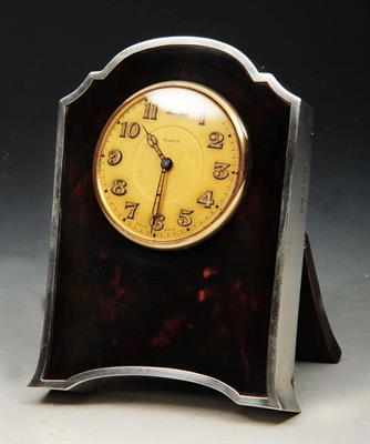 Lot 87 - A TORTOISESHELL AND SILVER MOUNTED BEDSIDE TIMEPIECE with circular dial and Swiss movement