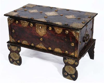 Lot 104 - AN ANTIQUE DUTCH COLONIAL TRAVELLING CHEST with engraved brass mounts and studs