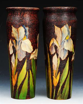 Lot 111 - A PAIR OF ART NOUVEAU PAINTED WOODEN VASES decorated flag irises on a bark ground