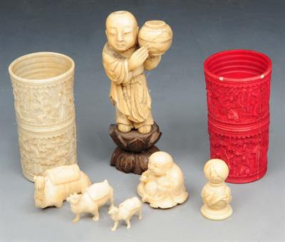 Lot 116 - A LATE 19TH CENTURY JAPANESE CARVED IVORY FIGURE of a boy holding a ginger jar on hardwood stand