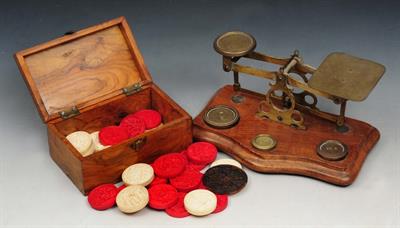 Lot 117 - A MIDDLE EASTERN OLIVE WOOD BOX containing a collection of Chinese counters
