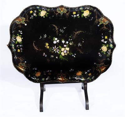 Lot 121 - A VICTORIAN PAPIER MÂCHÉ TRAY TABLE with folding top and mother of pearl and painted decoration