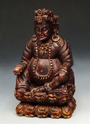Lot 238 - A TIBETAN WOODEN CARVING of Kubera 'The God of Wealth'