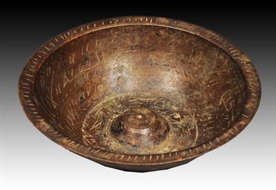 Lot 244 - A MIDDLE EASTERN METAL DIVINATION 'MAGIC' BOWL with etched inscriptions