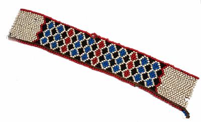 Lot 257 - A SOUTH AFRICAN ZULU BEADWORK PANEL with geometric designs