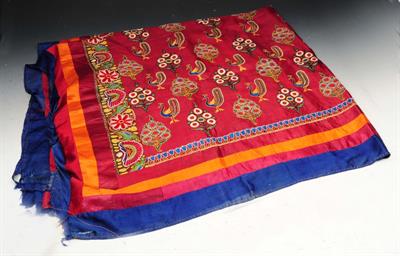 Lot 259 - AN INDIAN KUTCH BURGUNDY SILK DRESS PANEL embroidered in coloured silks with peacock and flower moti