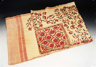 Lot 260 - AN INDIAN COTTON CLOTH embroidered in coloured silks with flower motifs and a mirror work