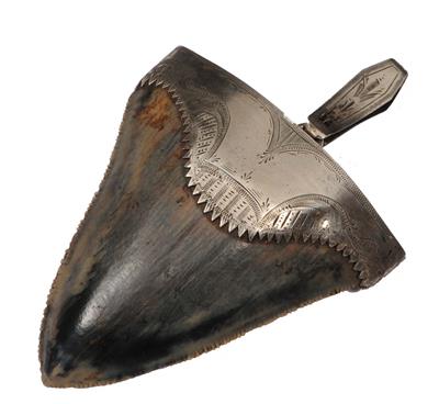 Lot 272 - AN 18TH CENTURY SILVER COLOURED METAL MOUNTED SHARKS TOOTH PENDANT with finely engraved scrolls and
