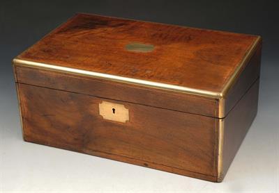 Lot 280 - AN EARLY VICTORIAN OAK AND BRASS BOUND WRITING SLOPE with fitted interior and hinged rising lid