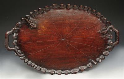 Lot 285 - AN ANTIQUE OVAL CARVED WOODEN TRAY with snake handles and frog ornament