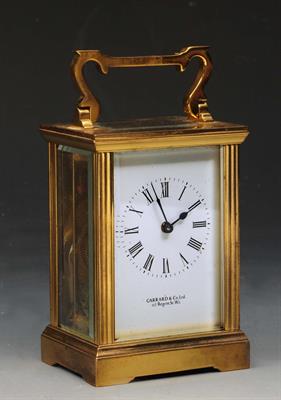 Lot 289 - A FRENCH BRASS CASED CARRIAGE TIMEPIECE with white enamel dial retailed by Garrard & Co Ltd
