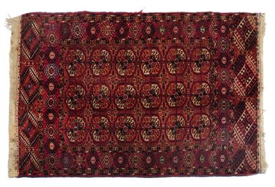 Lot 327 - AN OLD TURKOMAN DARK RED GROUND RUG with three rows of six guls within a hooked border