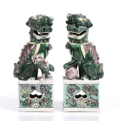 Lot 27 - A pair of Chinese model temple dogs
