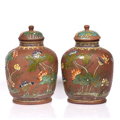 Lot 98 - A pair of Chinese Xin stone ware vases and covers