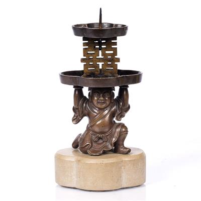 Lot 193 - A Chinese bronze candlestick