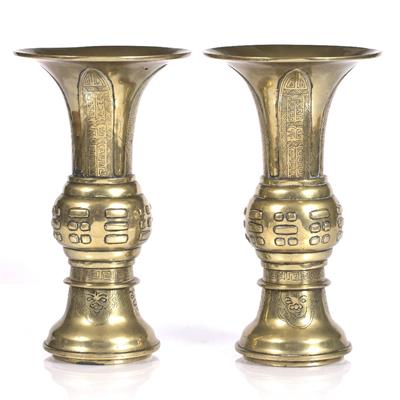 Lot 195 - A pair of Chinese bronze gu shaped vases