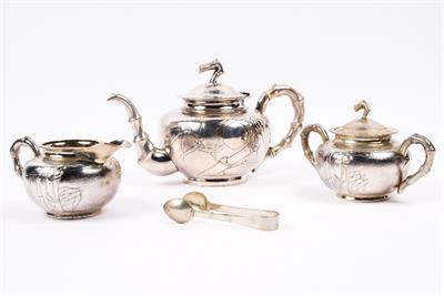 Lot 213 - A Chinese white metal three piece tea set