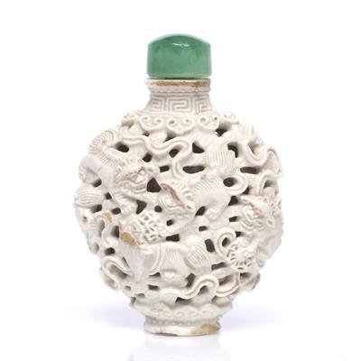 Lot 218 - A Chinese Jingdezhen white glazed porcelain oviform snuff bottle