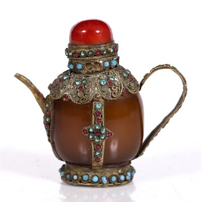 Lot 241 - A Tibetan amber snuff bottle