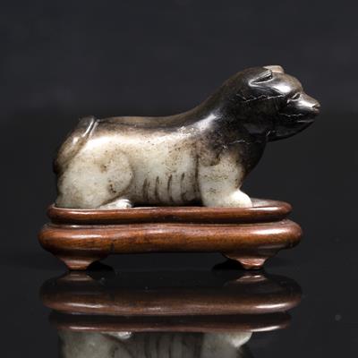 Lot 336 - A Chinese black and grey jade carving