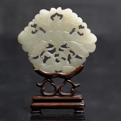 Lot 355 - A Chinese greyish white jade plaque