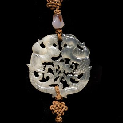 Lot 356 - A Chinese pierced and carved translucent and opaque agate pendant