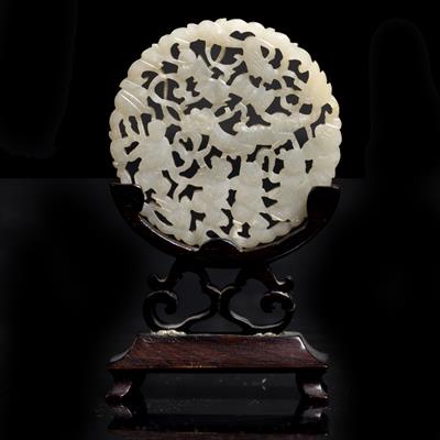 Lot 357 - A Chinese white jade pierced and carved medallion