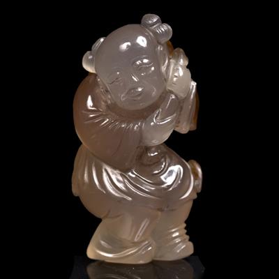 Lot 362 - A Chinese brown splashed pale translucent figure of a youth