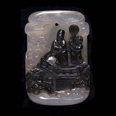 Lot 364 - A Chinese translucent greyish and black infused agate plaque pendant