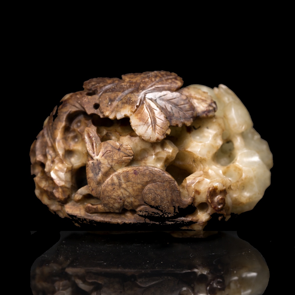 Lot 367 - A Chinese white and brown jade pebble
