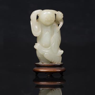 Lot 368 - A Chinese greyish white jade pebble carved as a standing of