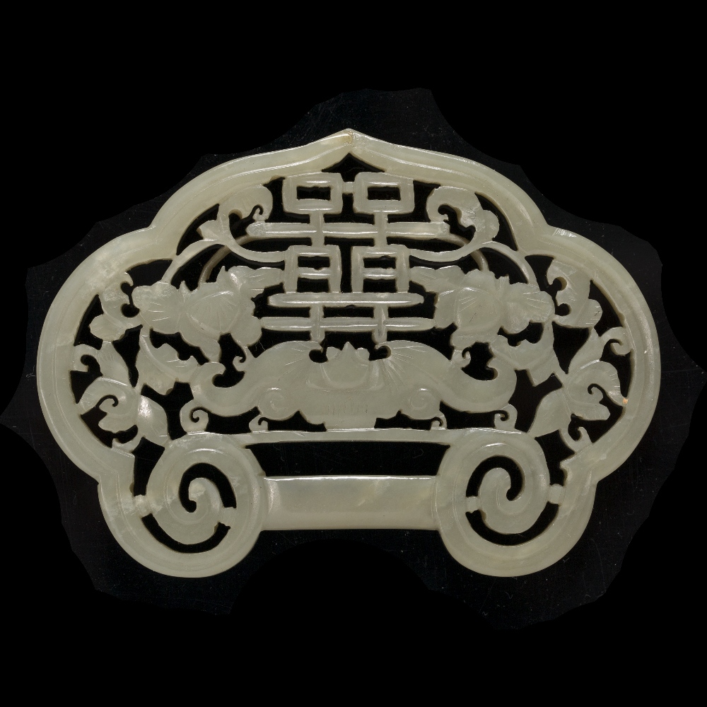 Lot 374 - A Chinese green jade belt buckle shaped pendant
