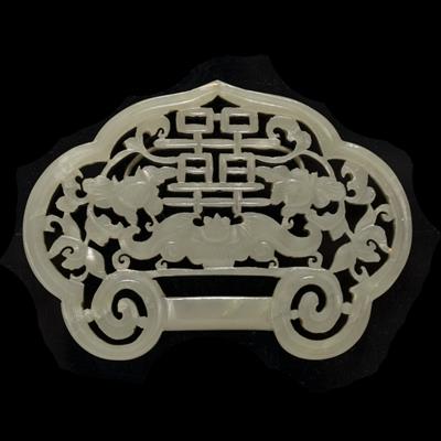 Lot 374 - A Chinese green jade belt buckle shaped pendant