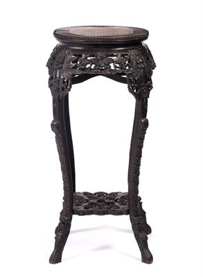 Lot 411 - A large Chinese hardwood urn stand