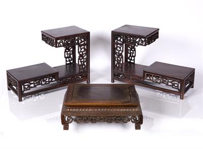 Lot 413 - A pair of Chinese tiered hardwood stands