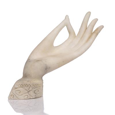 Lot 415 - A Chinese alabaster model of the hand of Guanyin