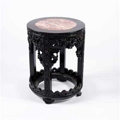 Lot 418 - A Chinese hardwood circular urn stand