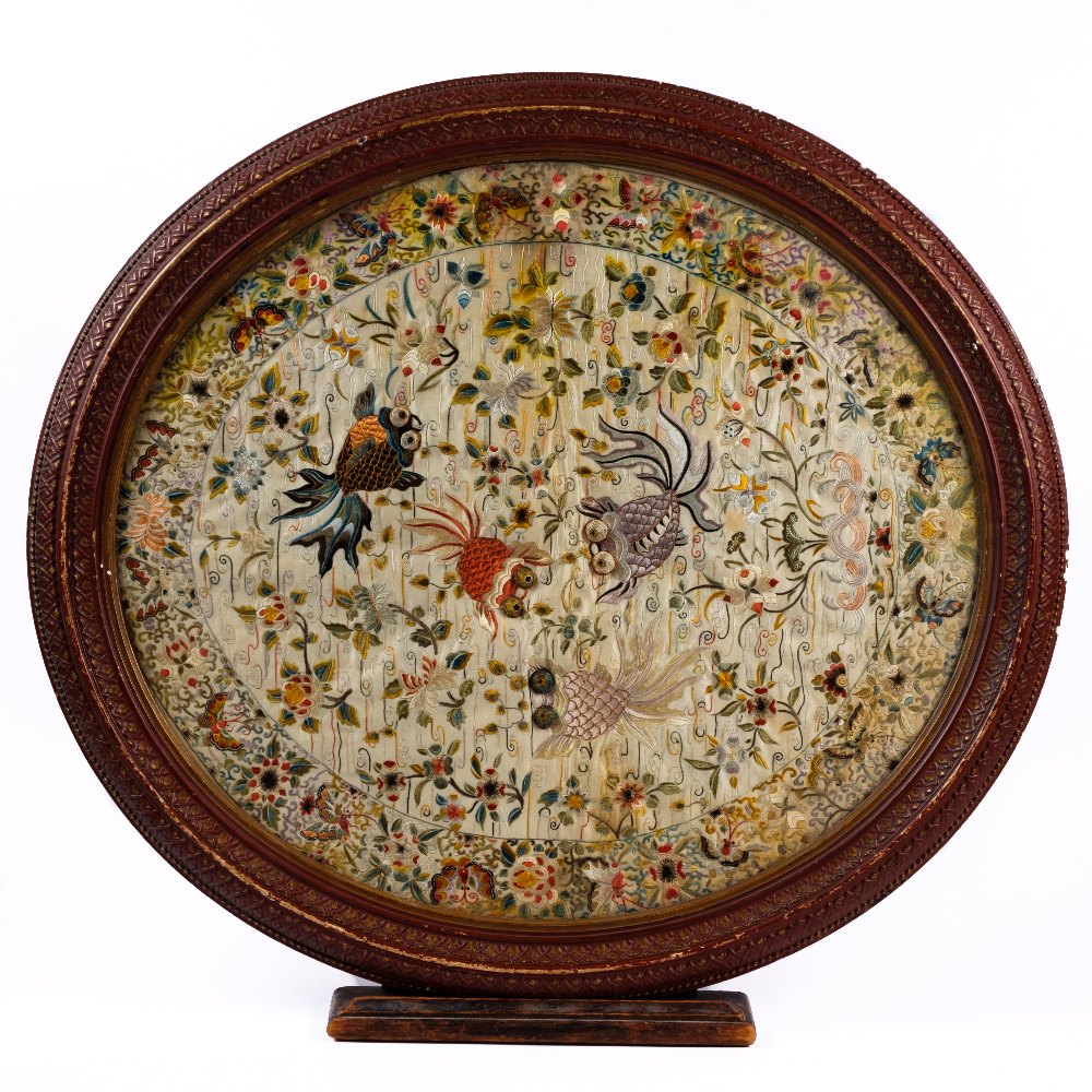 Lot 476 - A Chinese oval silk embroidered panel