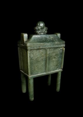 Lot 492 - A Chinese leaf green jade archaic bronze style ting