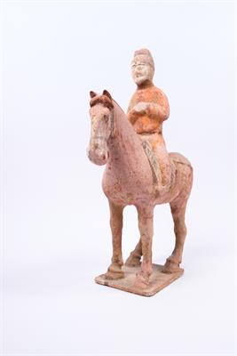 Lot 501 - A Tang unglazed pottery horse and rider