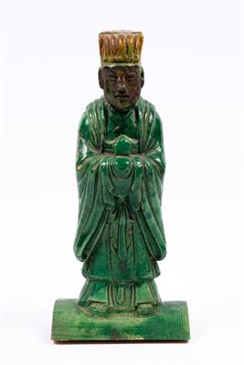 Lot 518 - A Chinese tile guardian figure