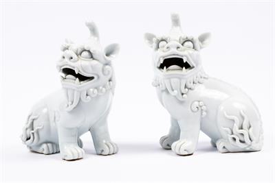 Lot 520 - A Pair of Chinese blanc de chine temple dogs