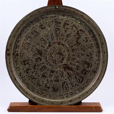 Lot 604 - A Persian engraved brass tray