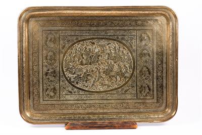 Lot 630 - A Qajar engraved rectangular brass tray