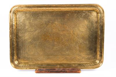 Lot 631 - A Qajar engraved rectangular brass tray